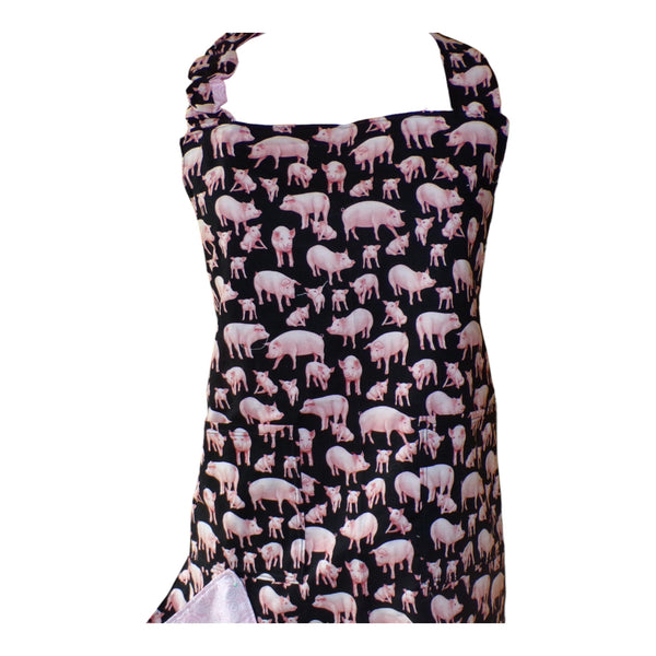 Apron with pigs on front and pink swirls on back