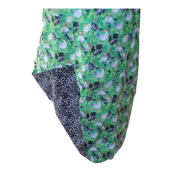 Green apron with chicken pattern on a white background